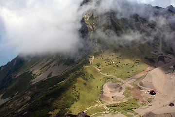 Image showing Clouds on the mountain slope