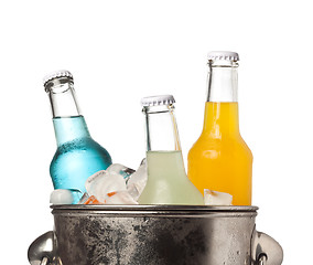 Image showing Bottles of soda and ice in a bucket