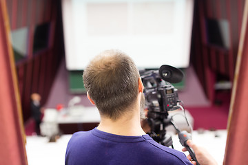 Image showing Television broadcasted press conference.