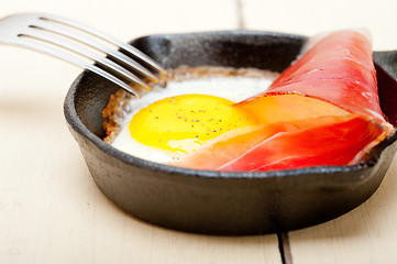 Image showing egg sunny side up with italian speck ham