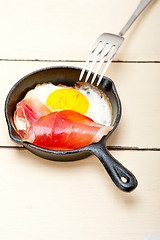 Image showing egg sunny side up with italian speck ham