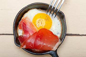 Image showing egg sunny side up with italian speck ham