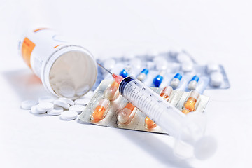 Image showing Syringe with glass vials and medications pills 