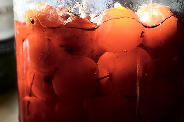 Image showing glass jar with canned apples sunlit