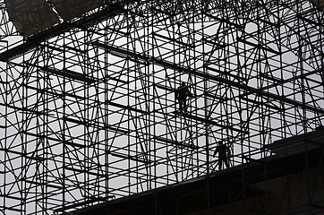 Image showing workers assemble metal construction