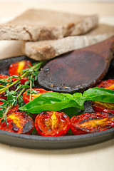 Image showing baked cherry tomatoes with basil anf thyme