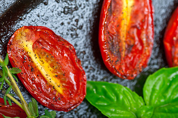 Image showing baked cherry tomatoes with basil anf thyme