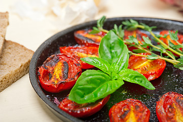 Image showing baked cherry tomatoes with basil anf thyme