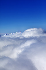 Image showing Mountains under clouds at sun day