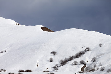 Image showing Off piste slope and overcast gray sky in windy day