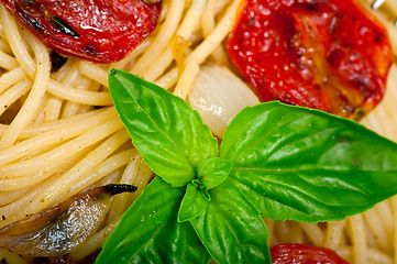 Image showing spaghetti pasta with baked cherry tomatoes and basil 