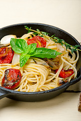 Image showing spaghetti pasta with baked cherry tomatoes and basil 