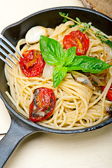 Image showing spaghetti pasta with baked cherry tomatoes and basil 