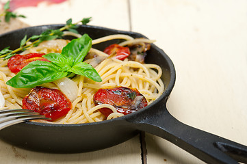 Image showing spaghetti pasta with baked cherry tomatoes and basil 