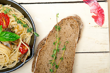 Image showing spaghetti pasta with baked cherry tomatoes and basil 