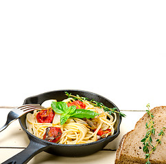 Image showing spaghetti pasta with baked cherry tomatoes and basil 