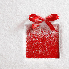 Image showing gift on snow background