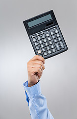 Image showing Businessman hold with calculator