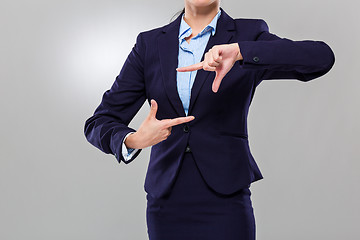 Image showing Businesswoman two hand build frame together