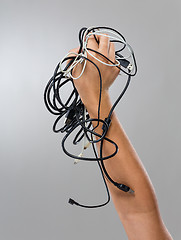 Image showing Hand hold with lots of cable