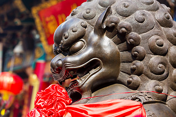 Image showing Lion statue in front of chinese temple 