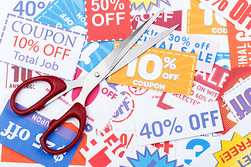 Image showing Money saving coupon vouchers with scissors