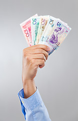 Image showing Businessman hand hold with chinese banknote