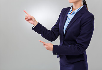 Image showing Businesswoman two finger point aside