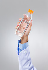 Image showing Doctor hold with water bottle