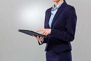 Image showing Businesswoman touch on the screen of digital tablet