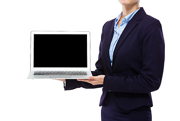 Image showing Businesswoman show laptop computer with blank screen