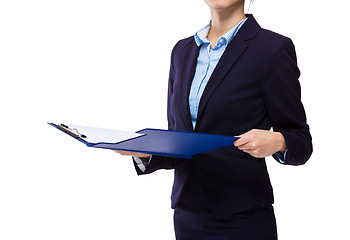 Image showing Businesswoman check with clipboard