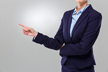 Image showing Businesswoman finger point aside