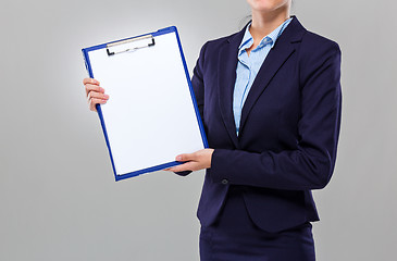 Image showing Businesswoman show with blank clipboard