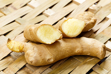 Image showing Fresh ginger on bamboo mat