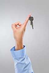 Image showing Businessman hand hold with home key