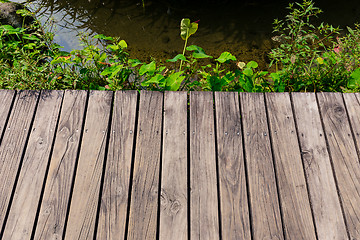 Image showing Wooden floor with lake
