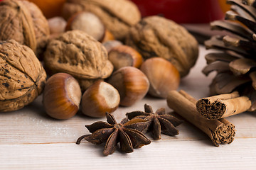 Image showing Different kinds of spices, nuts and dried oranges - christmas de