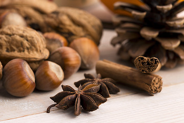 Image showing Different kinds of spices, nuts and dried oranges - christmas de