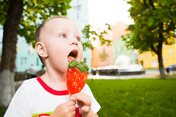 Image showing young boy with colorful lollipop