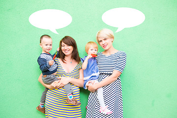 Image showing two beautiful girls with a children