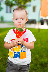Image showing young boy with colorful lollipop