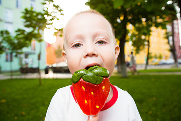 Image showing young boy with colorful lollipop