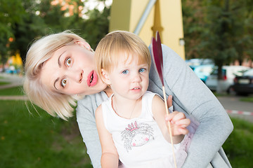 Image showing portrait of beautiful mother and kid girl outdoors in park