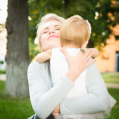 Image showing happy mother holding her child