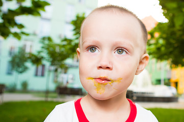 Image showing young boy with colorful lollipop