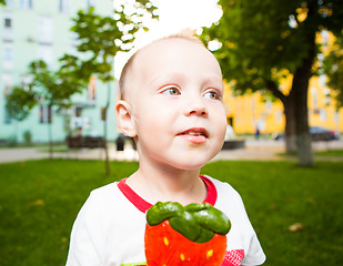 Image showing young boy with colorful lollipop