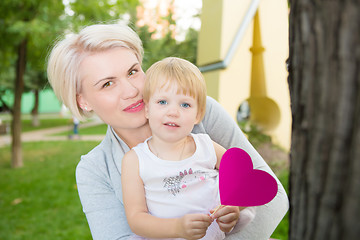 Image showing portrait of beautiful mother and kid girl outdoors in park