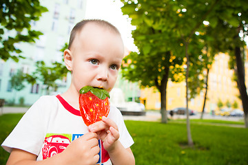 Image showing young boy with colorful lollipop