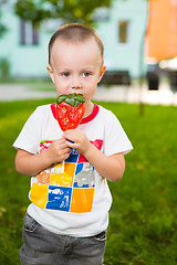 Image showing young boy with colorful lollipop